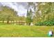 Beautiful pond with green grass and lush trees at 11941 Skylake Pl # 11941, Temple Terrace, FL 33617