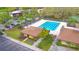 Overhead shot of community pool and parking, plus tennis courts at 11941 Skylake Pl # 11941, Temple Terrace, FL 33617