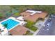 Aerial view of community pool and clubhouse with neatly arranged parking spaces at 11941 Skylake Pl # 11941, Temple Terrace, FL 33617