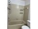 Close up of tiled shower and tub featuring shower head and soap dish at 11941 Skylake Pl # 11941, Temple Terrace, FL 33617