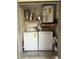 Practical utility room featuring a washer, dryer, shelving with paint supplies and a water heater at 11941 Skylake Pl # 11941, Temple Terrace, FL 33617