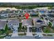 Aerial view of home and landscaping on a quiet street, with ample parking and community at 12017 Gillingham Harbor Ln, Gibsonton, FL 33534