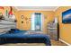 Bright bedroom with a stylish bed, a sleek dresser, and modern wall decor, perfect for relaxation at 12017 Gillingham Harbor Ln, Gibsonton, FL 33534