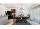 Dining room features chandelier, dining table set for four, and an area rug at 12017 Gillingham Harbor Ln, Gibsonton, FL 33534