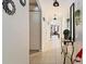 Bright hallway with decorative mirrors and a view into the living area, providing a welcoming ambiance at 12017 Gillingham Harbor Ln, Gibsonton, FL 33534