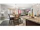 An open-concept living and dining area with modern furnishings and plenty of natural light at 12017 Gillingham Harbor Ln, Gibsonton, FL 33534