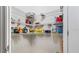 Organized pantry features shelving for ample storage of food and cooking essentials in this home at 12017 Gillingham Harbor Ln, Gibsonton, FL 33534