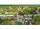 Aerial view of the home and surrounding neighborhood with lush trees at 1320 Oak Valley Dr, Seffner, FL 33584
