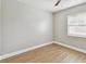 Bright bedroom featuring wood floors, a window, and neutral paint at 1320 Oak Valley Dr, Seffner, FL 33584