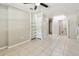 Bedroom with tile floors, open shelving, and additional storage at 1320 Oak Valley Dr, Seffner, FL 33584