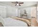 Bedroom featuring the entrance to the bathroom and neutral decor at 1320 Oak Valley Dr, Seffner, FL 33584