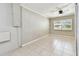 Bedroom with tile floors, a ceiling fan, and a window overlooking the yard at 1320 Oak Valley Dr, Seffner, FL 33584