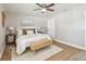 Bedroom featuring a large window, ceiling fan, neutral decor, and a view of the door at 1320 Oak Valley Dr, Seffner, FL 33584