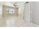 Bedroom featuring tile floors, a ceiling fan, and a window at 1320 Oak Valley Dr, Seffner, FL 33584