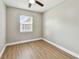 Bright, empty bedroom with a window, ceiling fan, and neutral walls at 1320 Oak Valley Dr, Seffner, FL 33584