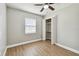 Cozy bedroom featuring light wood floors, a ceiling fan, and a closet with bifold doors at 1320 Oak Valley Dr, Seffner, FL 33584