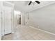 Bedroom featuring tile floors, shelving, and access to additional rooms at 1320 Oak Valley Dr, Seffner, FL 33584