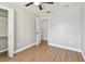 Bedroom featuring light wood floors, a ceiling fan, and neutral-colored walls at 1320 Oak Valley Dr, Seffner, FL 33584
