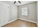 Bright, empty bedroom featuring a window, ceiling fan, and a closet at 1320 Oak Valley Dr, Seffner, FL 33584