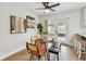 Dining area features sliding glass doors to backyard and modern furniture at 1320 Oak Valley Dr, Seffner, FL 33584