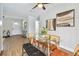 Well-lit dining room with modern table, stylish chairs, and contemporary artwork at 1320 Oak Valley Dr, Seffner, FL 33584
