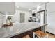 Modern kitchen features stainless appliances, quartz countertops, and white cabinets at 1320 Oak Valley Dr, Seffner, FL 33584