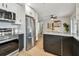 Open-concept kitchen with stainless steel appliances and updated features at 1320 Oak Valley Dr, Seffner, FL 33584