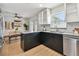 Modern kitchen featuring stainless steel appliances, gray countertops, and stylish backsplash at 1320 Oak Valley Dr, Seffner, FL 33584