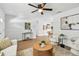 Bright living room with ceiling fan, modern decor, and stylish furnishings at 1320 Oak Valley Dr, Seffner, FL 33584