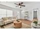 Inviting living room with natural light, cozy sofa, and contemporary decor at 1320 Oak Valley Dr, Seffner, FL 33584