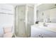 Bright bathroom featuring white cabinets, a glass shower, and updated fixtures at 14130 Rosemary Ln # 4215, Largo, FL 33774