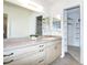 Bright bathroom with neutral countertops and tiled floor and walk-in closet at 14130 Rosemary Ln # 4215, Largo, FL 33774