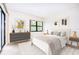 Sunlit bedroom features neutral colors, clean lines, and stylish furniture at 14130 Rosemary Ln # 4215, Largo, FL 33774