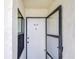 Front door with security door and unit number at 14130 Rosemary Ln # 4215, Largo, FL 33774