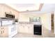 Open kitchen with view of dining area, stainless steel appliances at 14130 Rosemary Ln # 4215, Largo, FL 33774