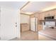 Galley kitchen with tan cabinets and tile flooring at 14130 Rosemary Ln # 4215, Largo, FL 33774