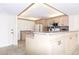 Kitchen area featuring an island and modern appliances at 14130 Rosemary Ln # 4215, Largo, FL 33774
