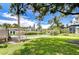 Community lawn bowling area surrounded by lush greenery and shaded benches at 14130 Rosemary Ln # 4215, Largo, FL 33774