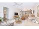 Comfortable living room space with seamless kitchen, dining and bathroom access at 14130 Rosemary Ln # 4215, Largo, FL 33774