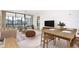 Open living and dining area with sliding glass doors, and neutral decor at 14130 Rosemary Ln # 4215, Largo, FL 33774