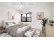 Cozy main bedroom with modern decor, a king bed, and a lovely lake view at 14130 Rosemary Ln # 4215, Largo, FL 33774