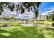Scenic community pond view with fountain and lush landscaping, perfect for relaxation at 14130 Rosemary Ln # 4215, Largo, FL 33774