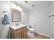 Clean half bathroom with modern fixtures and vanity with cabinet storage at 18004 Avalon Ln, Tampa, FL 33647