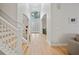 Grand foyer boasting soaring ceilings, a staircase, and double doors that flood the space with natural light at 18004 Avalon Ln, Tampa, FL 33647