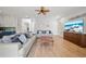 Open-concept living area featuring wood floors, modern lighting, and a neutral color scheme at 18004 Avalon Ln, Tampa, FL 33647