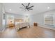 Bright main bedroom with neutral walls, hardwood floors, and natural light from the windows at 18004 Avalon Ln, Tampa, FL 33647