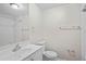 Clean bathroom featuring subway tile, modern fixtures, and white vanity at 1826 Cadillac Cir, Tampa, FL 33619
