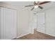 Bedroom featuring hardwood floors, neutral walls, and a closet at 1826 Cadillac Cir, Tampa, FL 33619