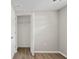 Bedroom featuring hardwood floors, and a closet with an open door at 1826 Cadillac Cir, Tampa, FL 33619