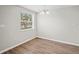 Bright dining room with updated flooring and a window offering natural light at 1826 Cadillac Cir, Tampa, FL 33619